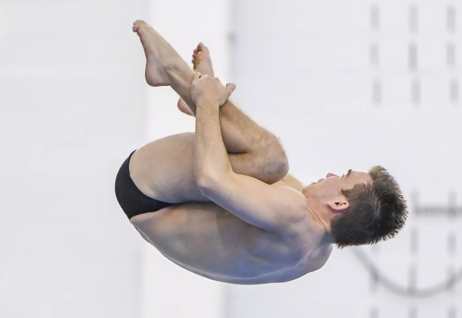 Nick Cover competes in the NCAA Zone platform diving competition.