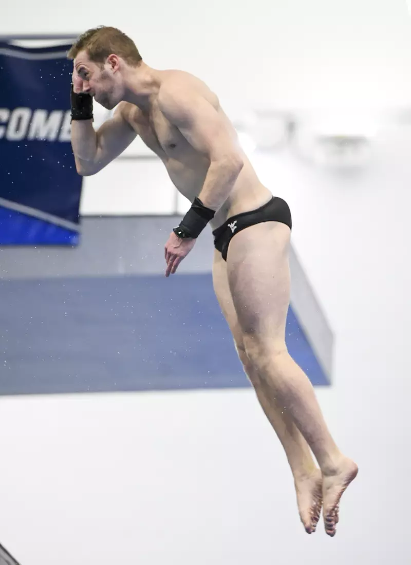 Austin Smith competes in the NCAA Zone platform diving competition.