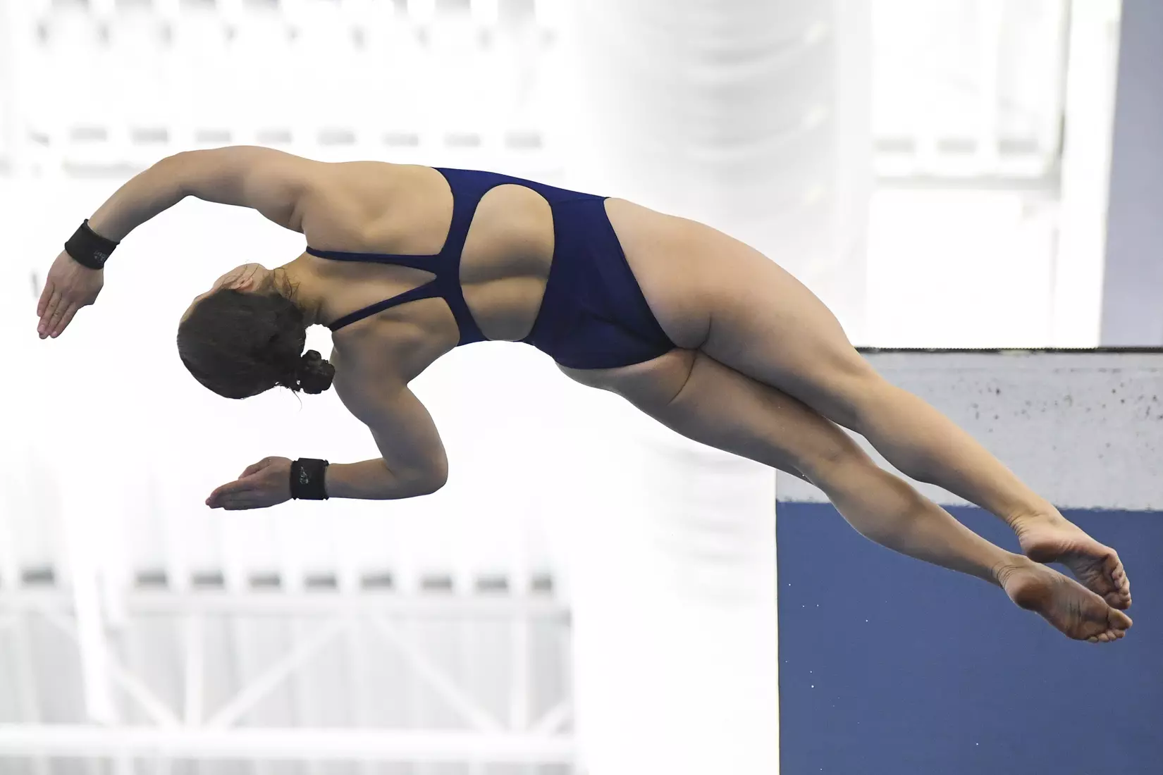 Camille Burt competes in the NCAA Zone platform diving competition.