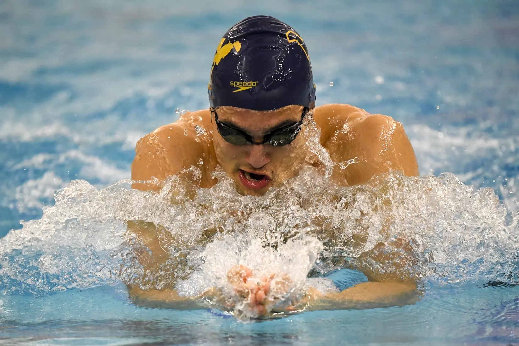 Fausto Huerta swims the breast stroke in the 400 Medley Relay.