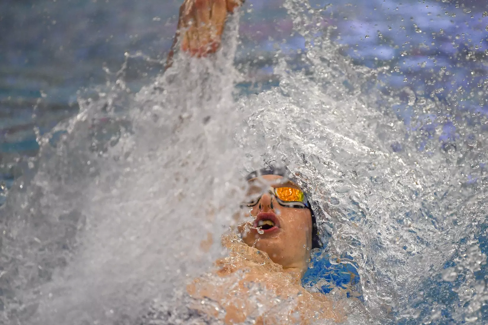 Hunter Armstong swims in the 100 yard backstroke.