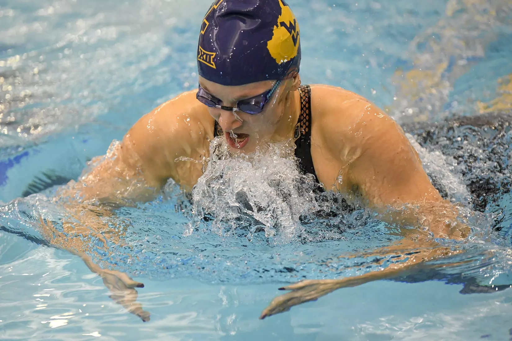 Lauren Beckish swims in the 100 yard breaststroke.