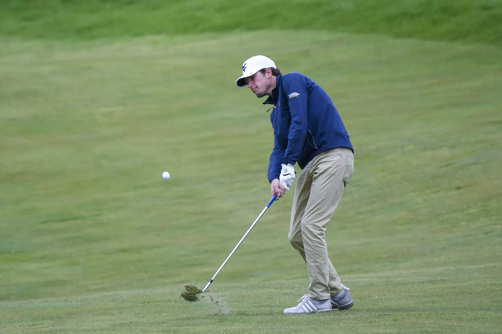 Logan Perkins hits a fairway shot.