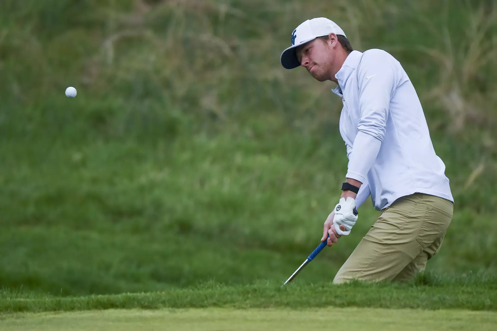 Trent Tipton chips on the seventh hole.