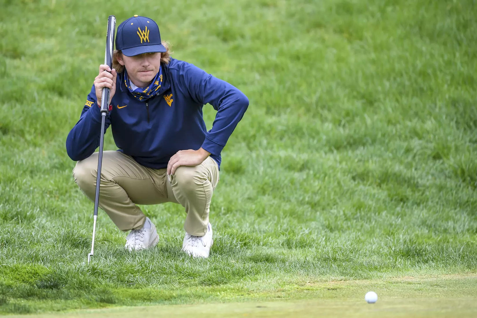 Jackson Davenport sizes-up a putt.