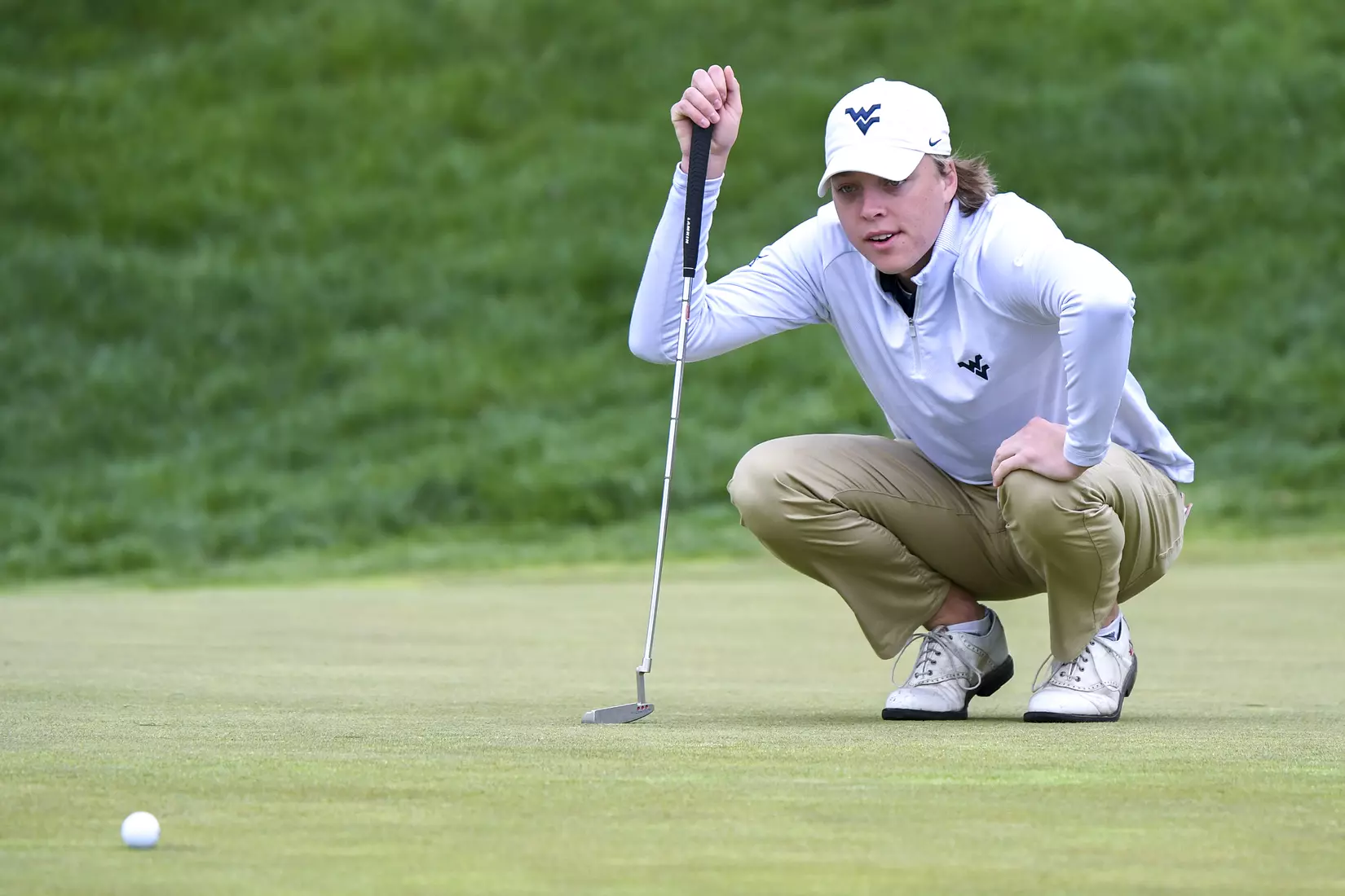 Oliver Menard lines-up a putt on hole six.