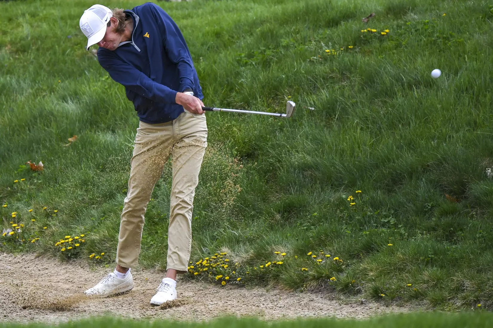 Mark Goetz hits from a fairway bunker on nine.