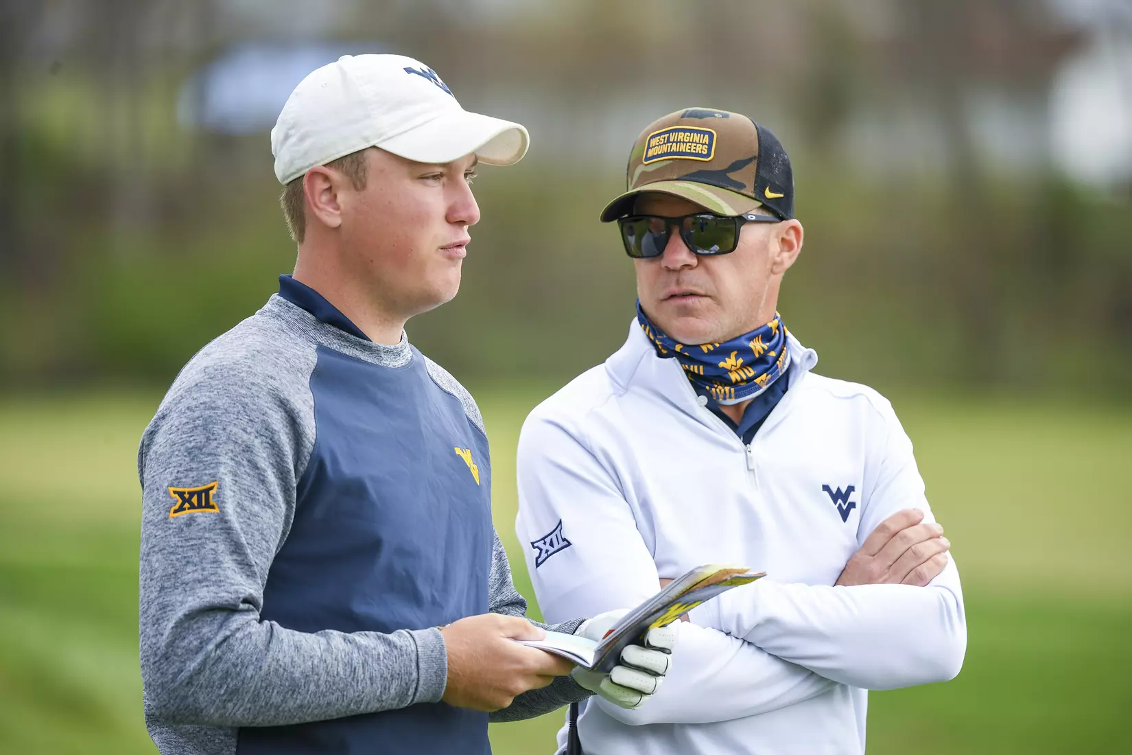 Kurtis Grant talks with coach Sean Covich.