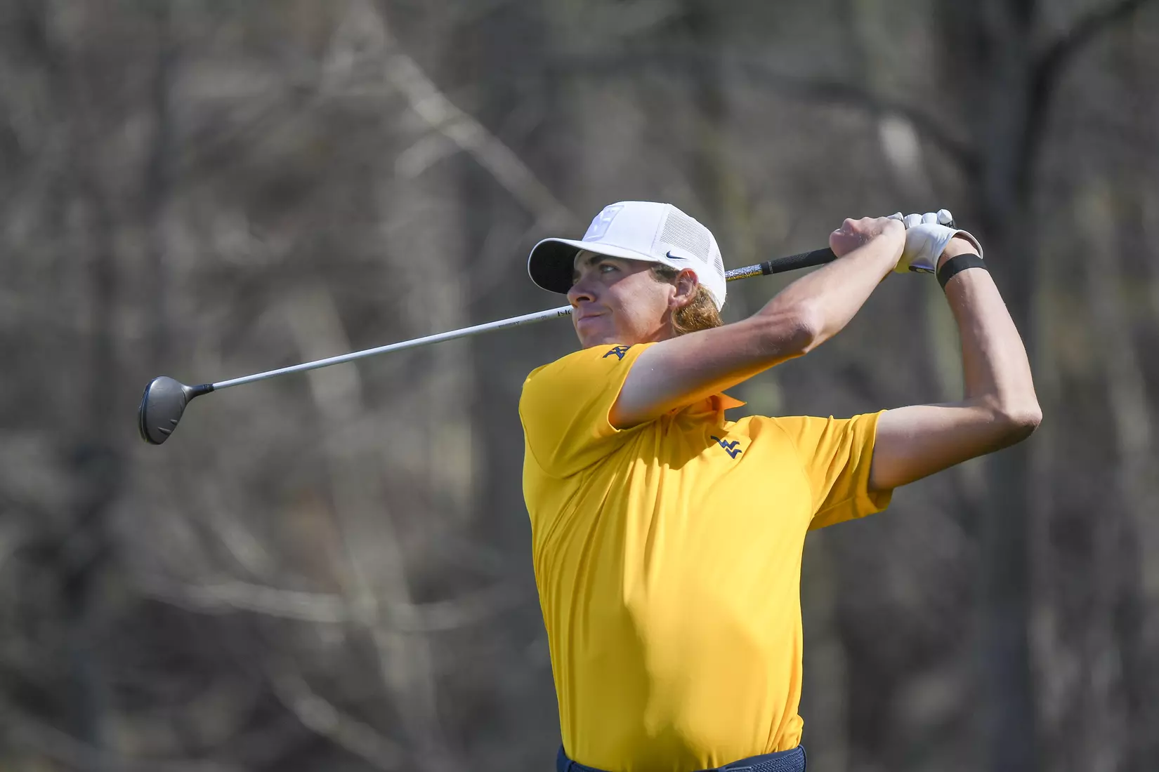 Individual medalist Mark Goetz watches his tee shot.