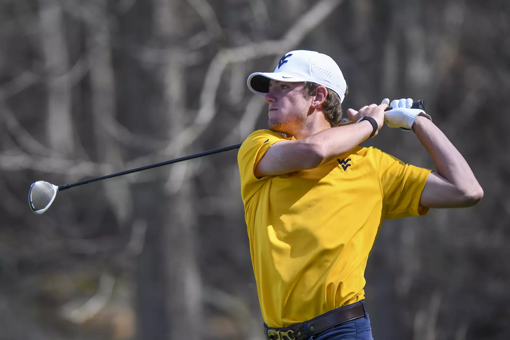Logan Perkins watches his tee shot.