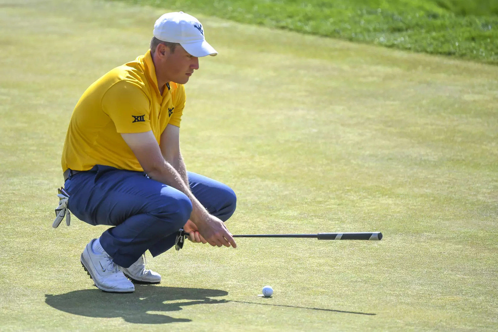 Kurtis Grant lines-up a putt.