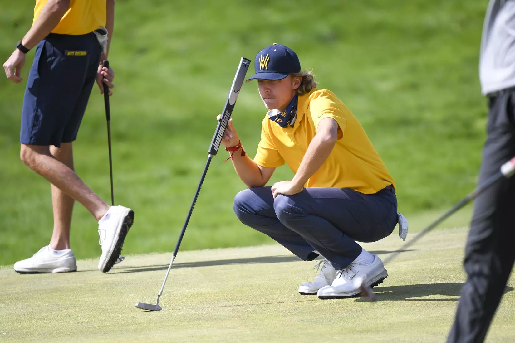 Jackson Davenport looks over a putt.