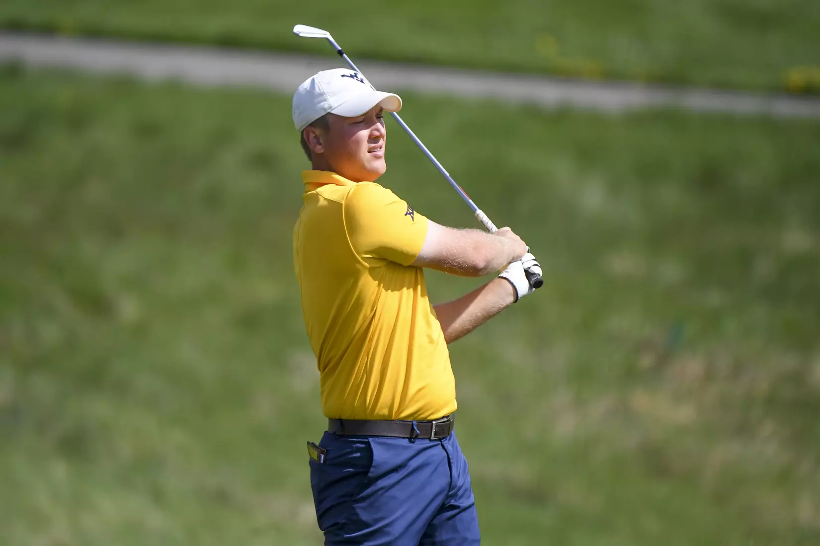 Kurtis Grant watches his tee shot on four.