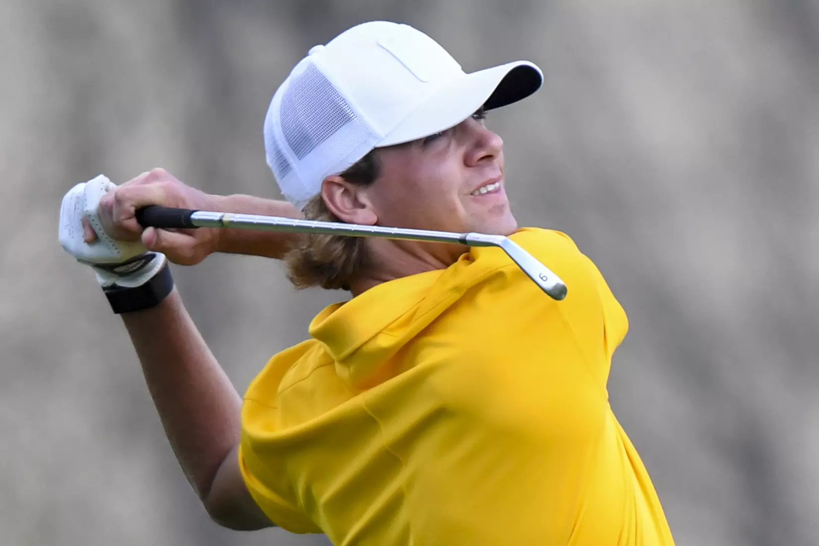 Individual medalist Mark Goetz watches his tee shot.