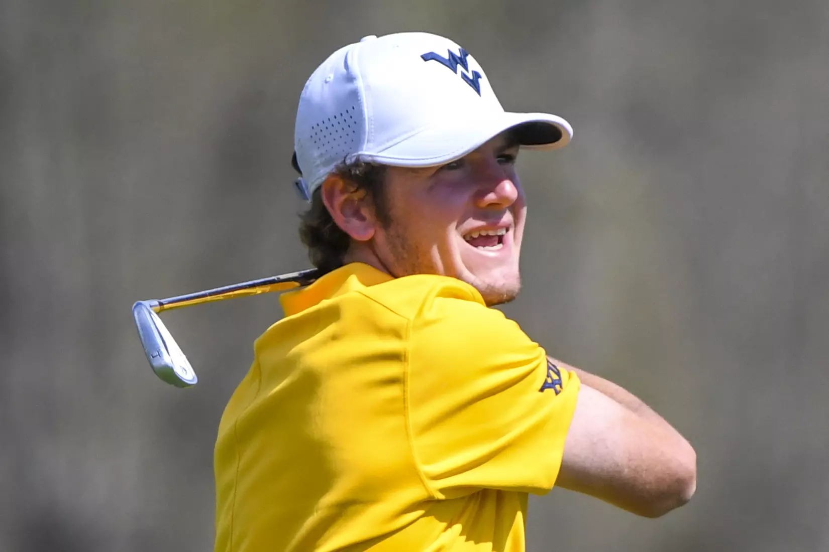 Logan Perkins watches his tee shot.