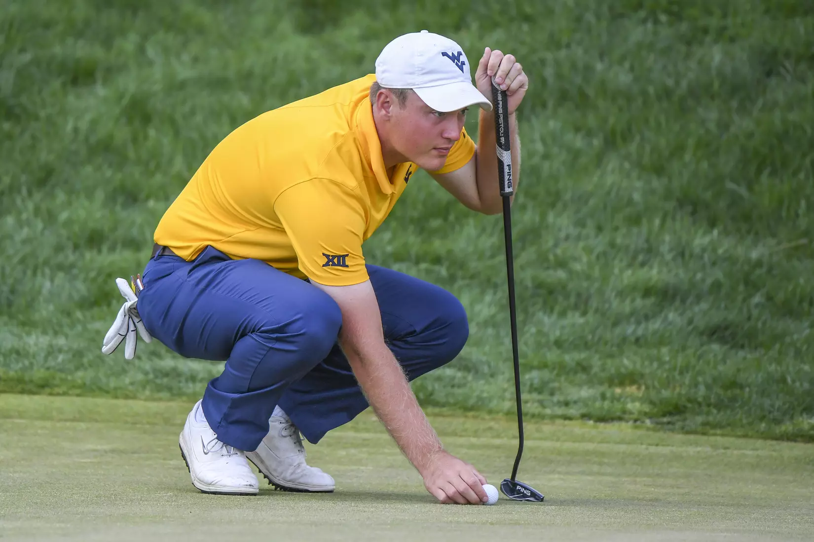 Kurtis Grant lines-up a putt.