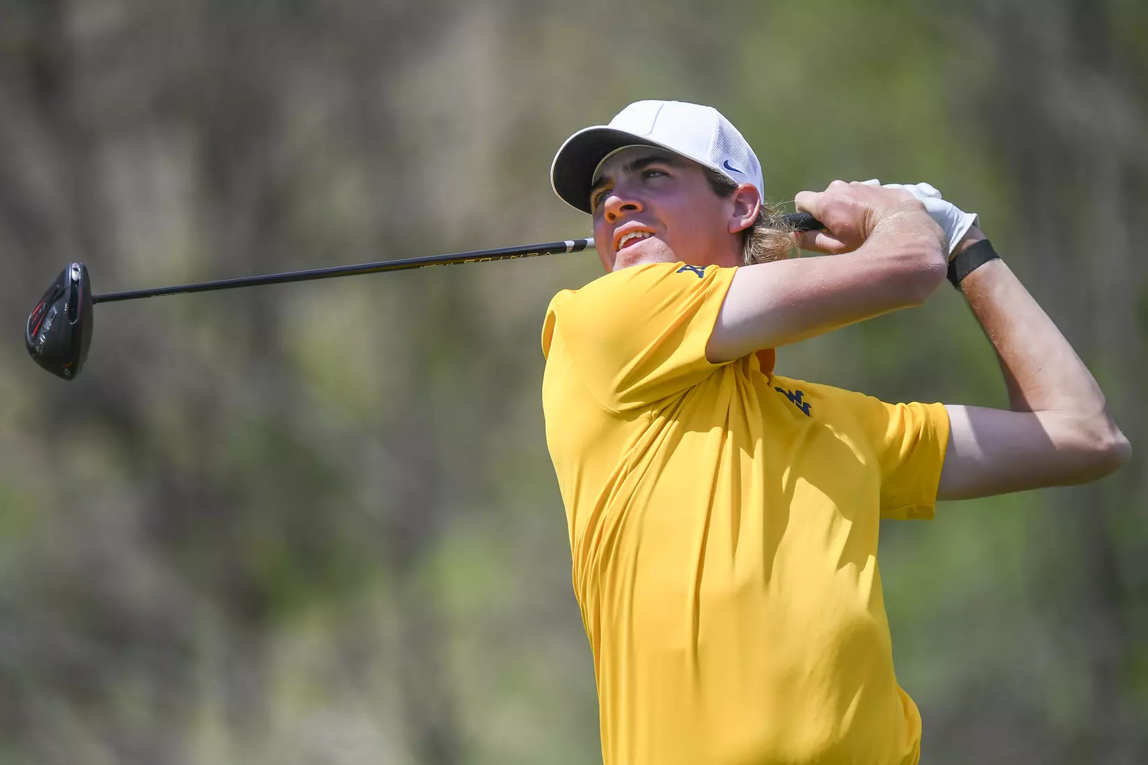 Individual medalist Mark Goetz watches his tee shot.