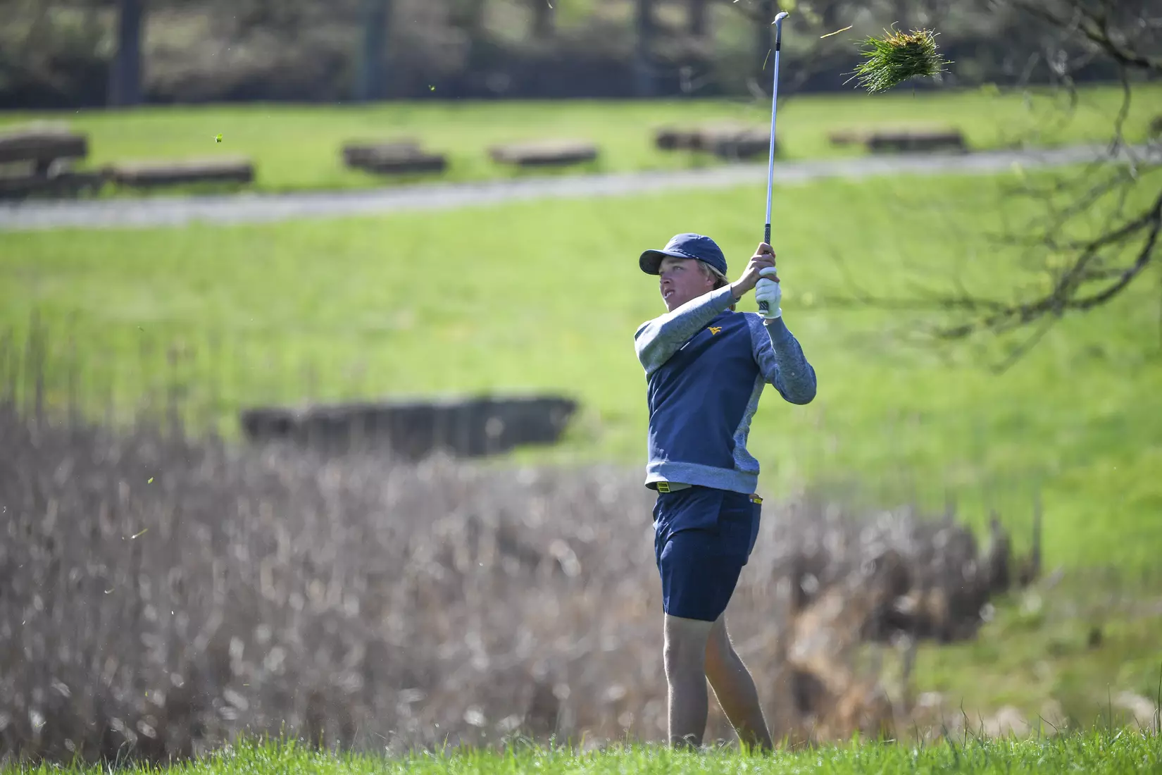 Oliver Menard takes a large chunk of the rough on a shot.