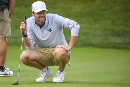 Trent Tipton smiles while sizing-up his putt.