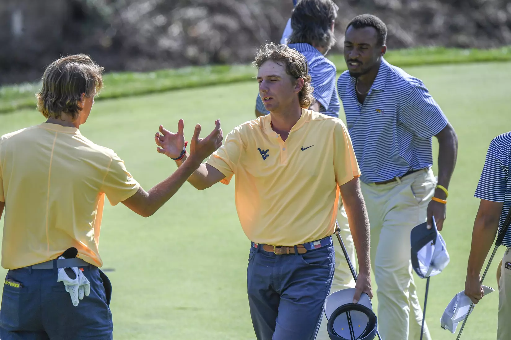Jackson Davenport congratulates Mark Goetz after the third round.