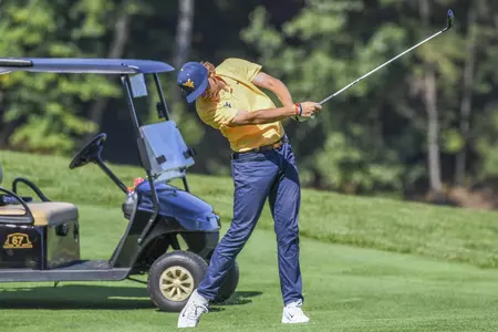 Jackson Davenport hits a 277-yard second shot on the par-5 11th hole.