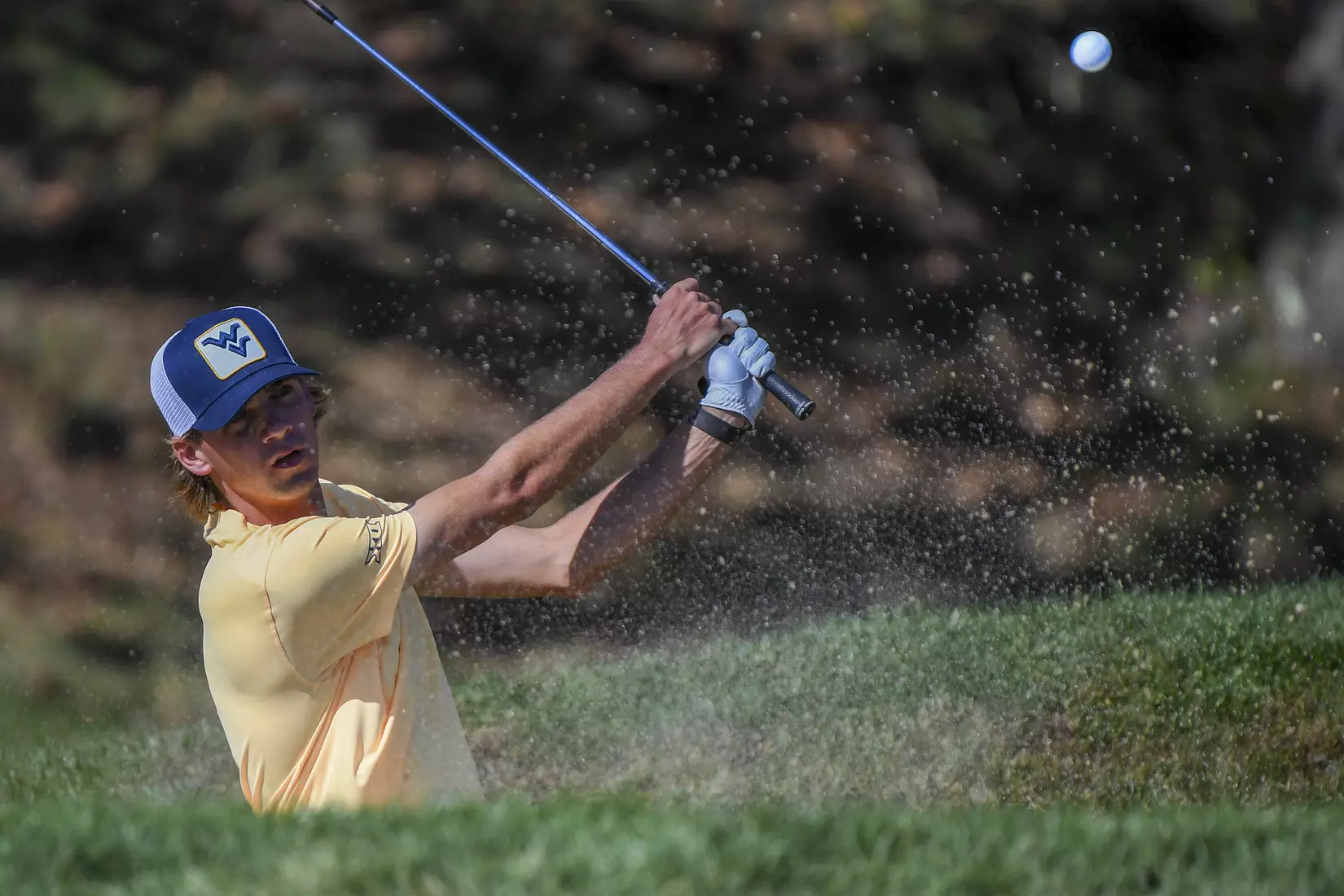 Mark Goetz blasts out of a bunker on the 11th hole