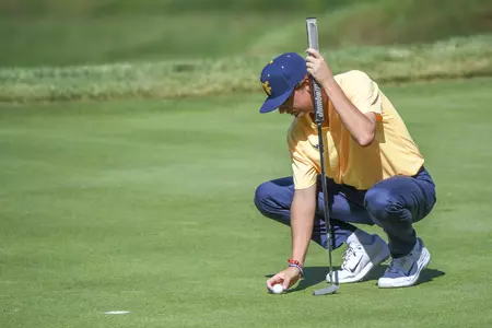 Jackson Davenport lines-up his successful eagle putt on 11.