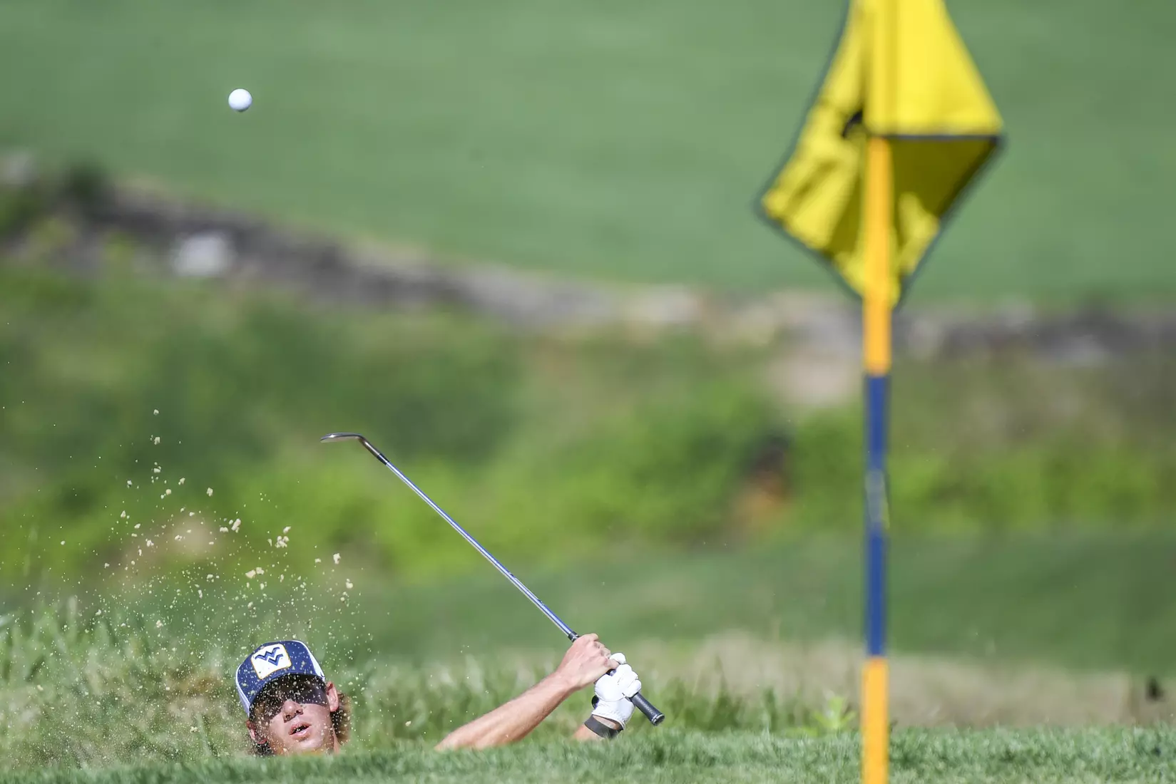 Mark Goetz hits a bunker shot.