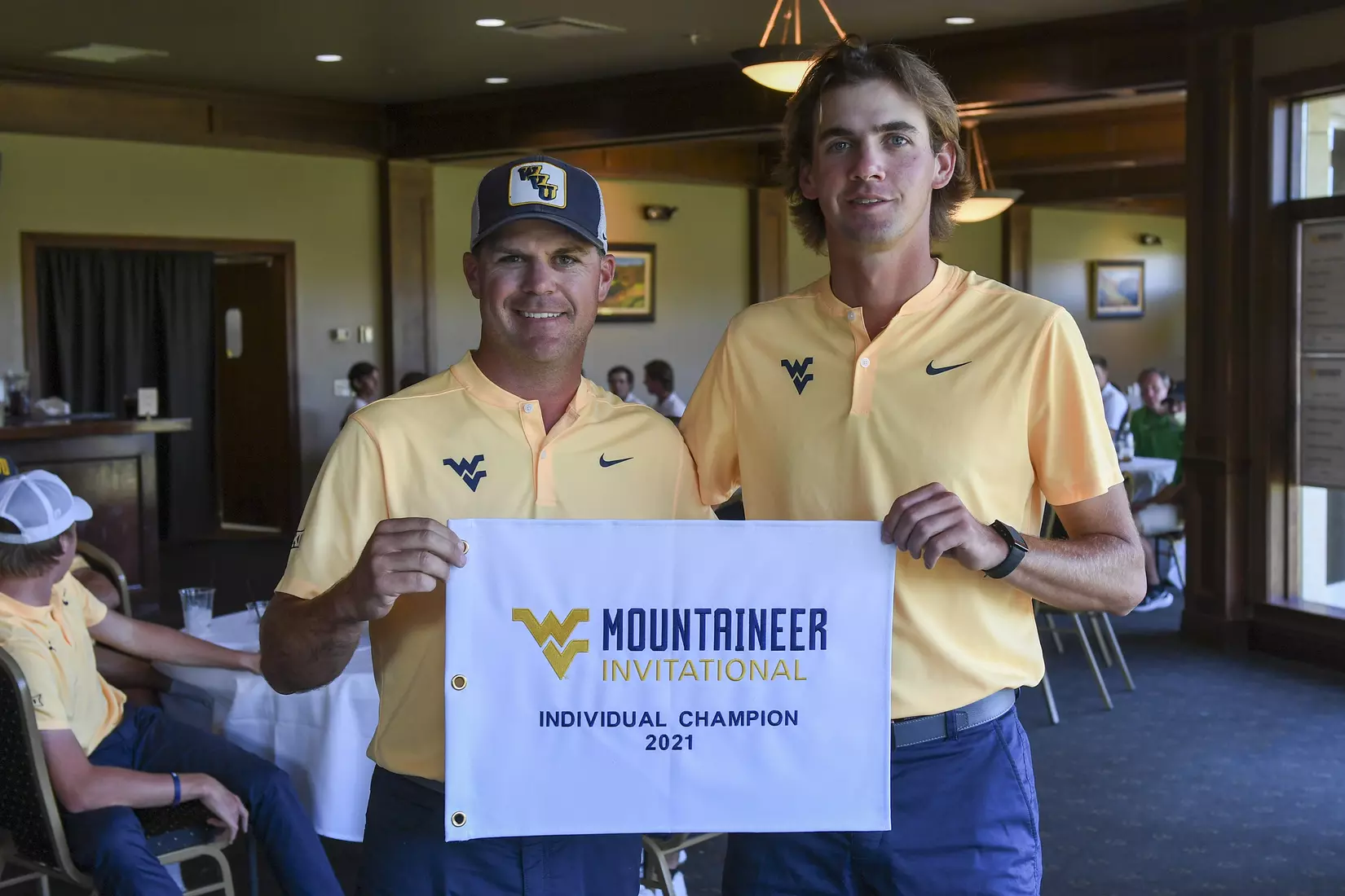 Coach Sean Covich presents Mark Goetz with the individual champion award.