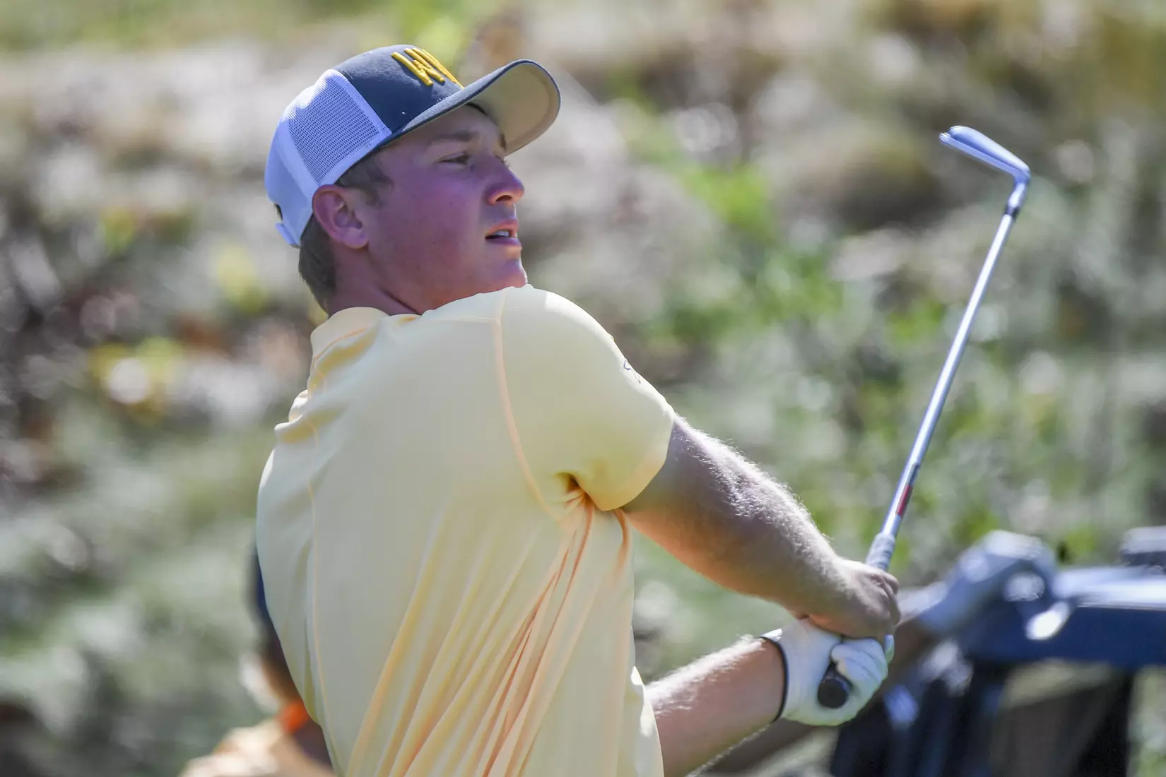 Kurtis Grant watches his tee shot on 16.