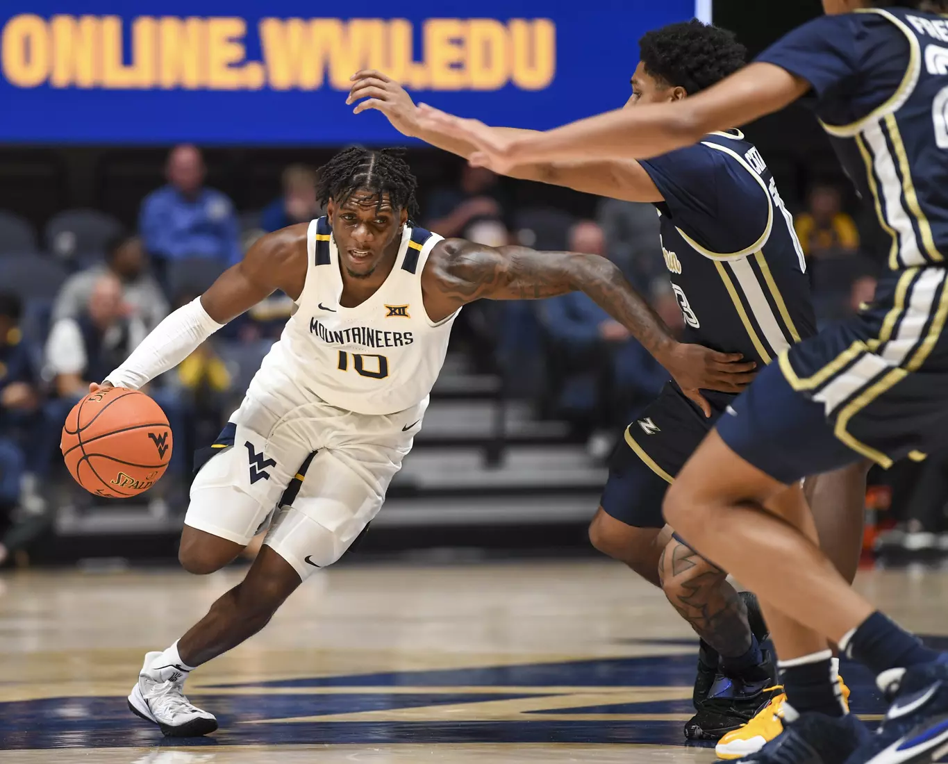 Malik Curry drives the ball.