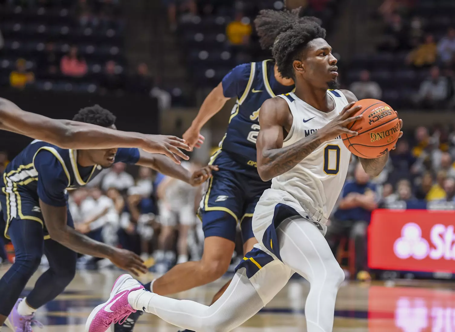 Kedrian Johnson slashes to the basket.