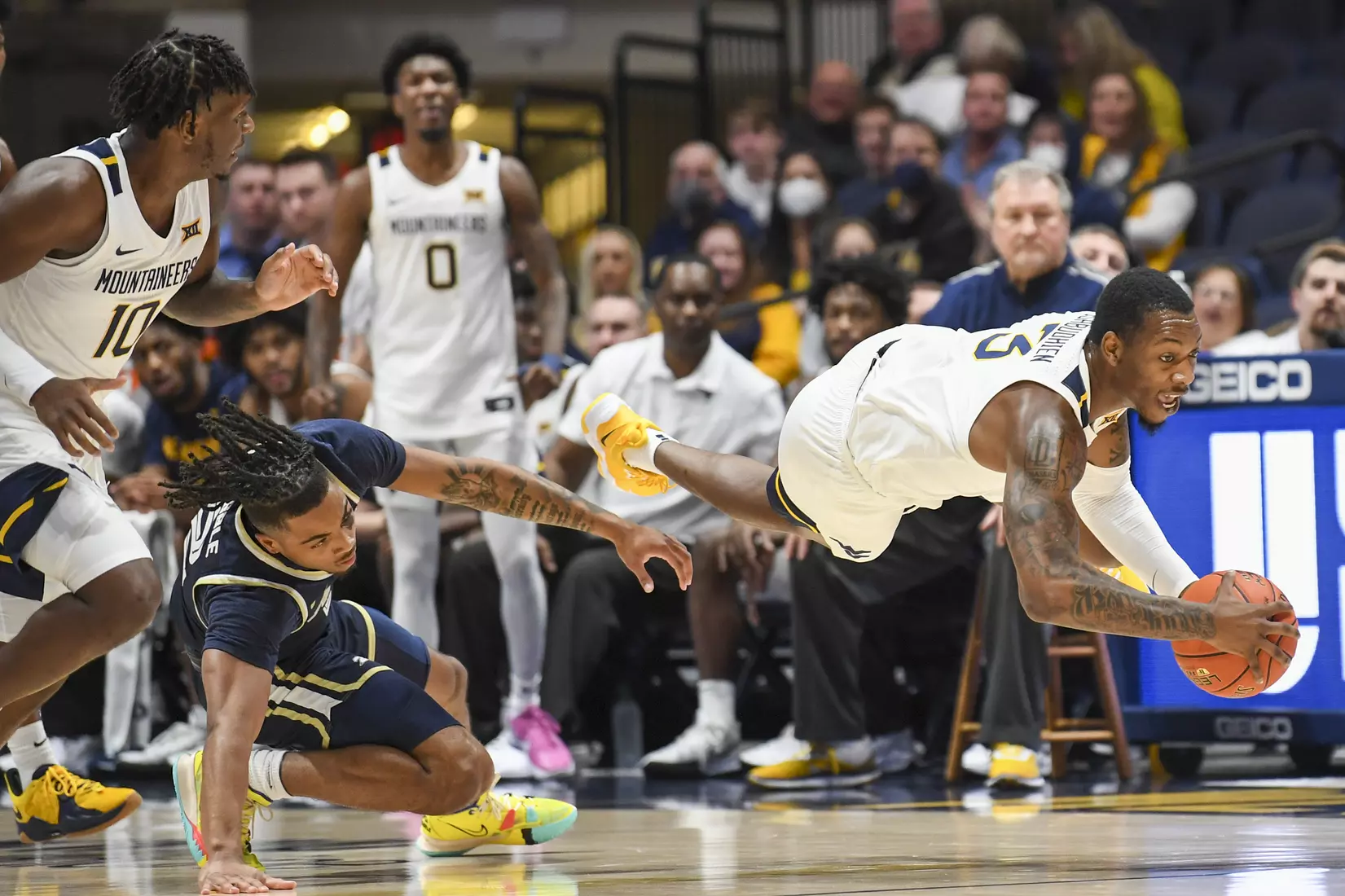 Gabe Osabuohien dives for a loose ball.