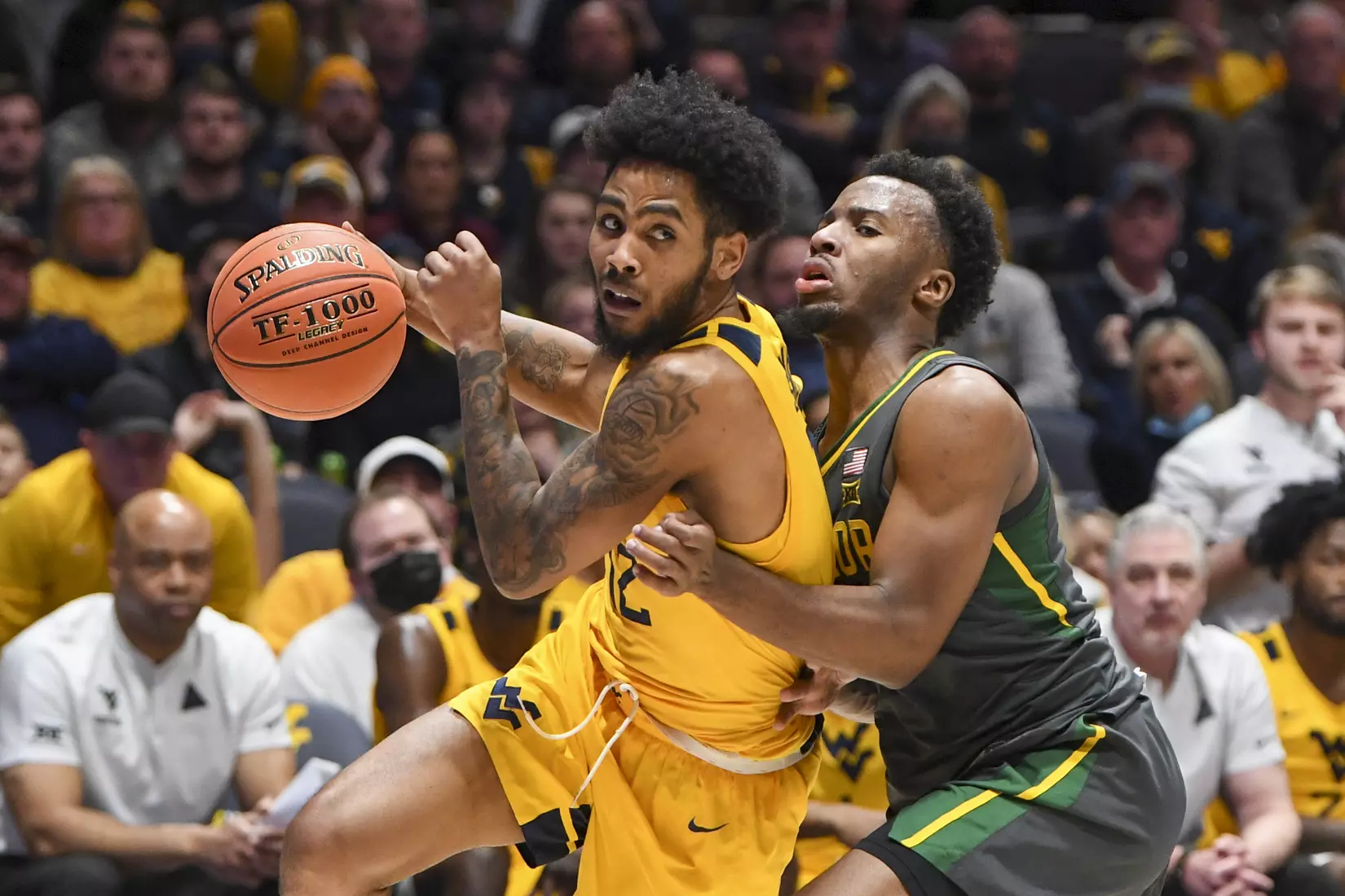 Taz Sherman drives around a defender.