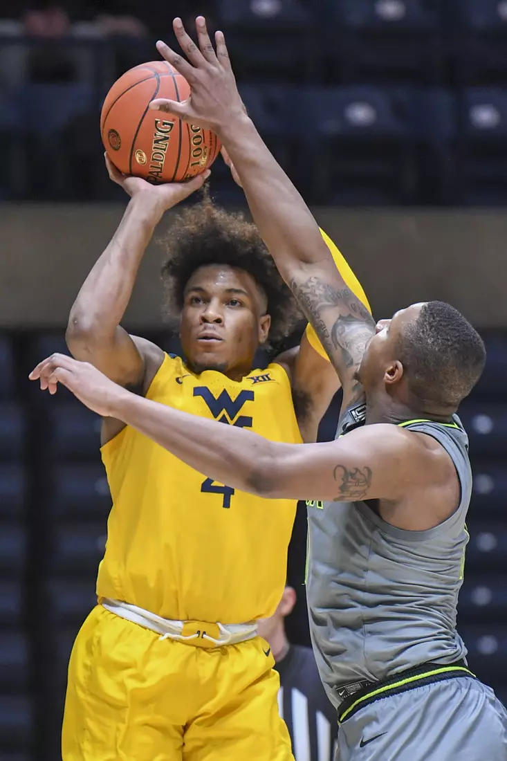 Miles McBride shoots a three.