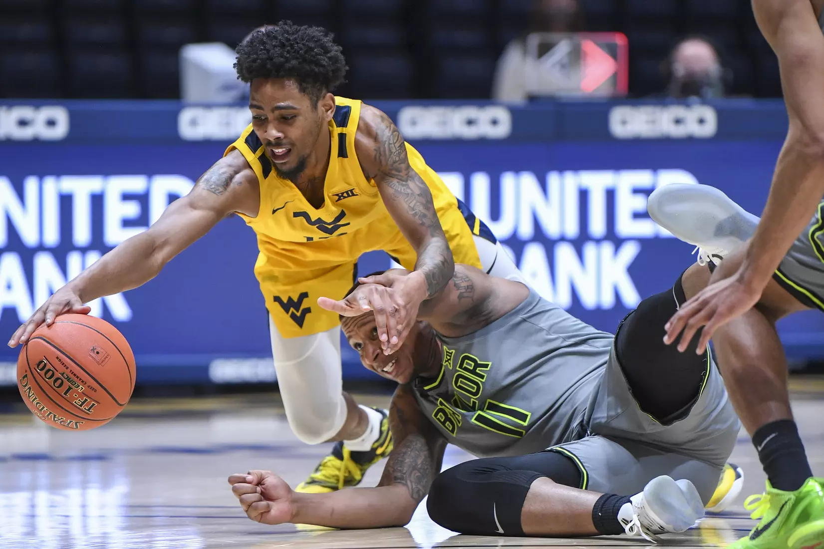 Taz Sherman dives for a loose ball.