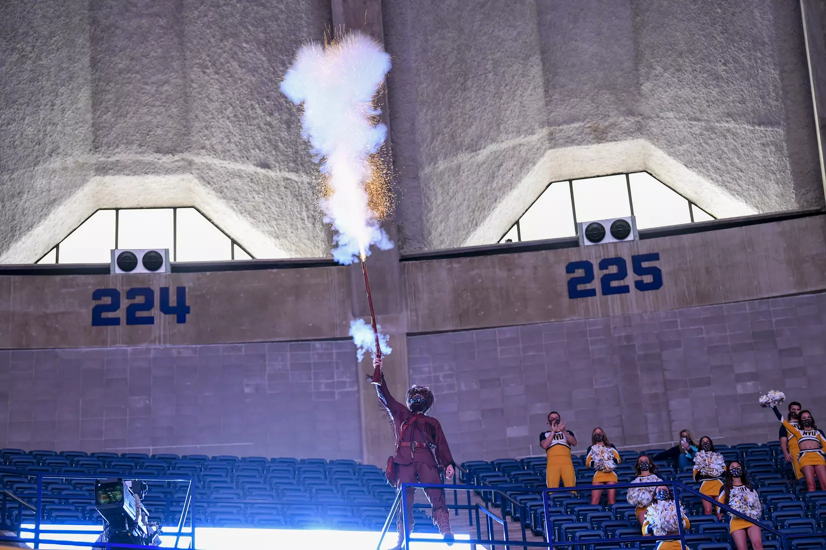 Mountaineer mascot Colson Glover fires the musket.
