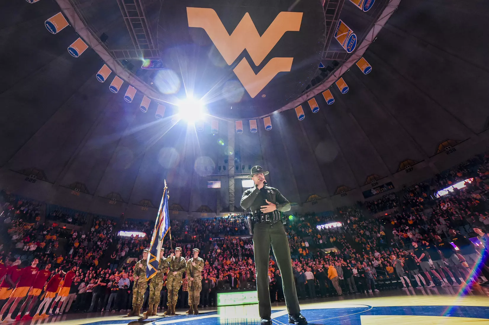 Trooper Carlton Smith sings the National Anthem.