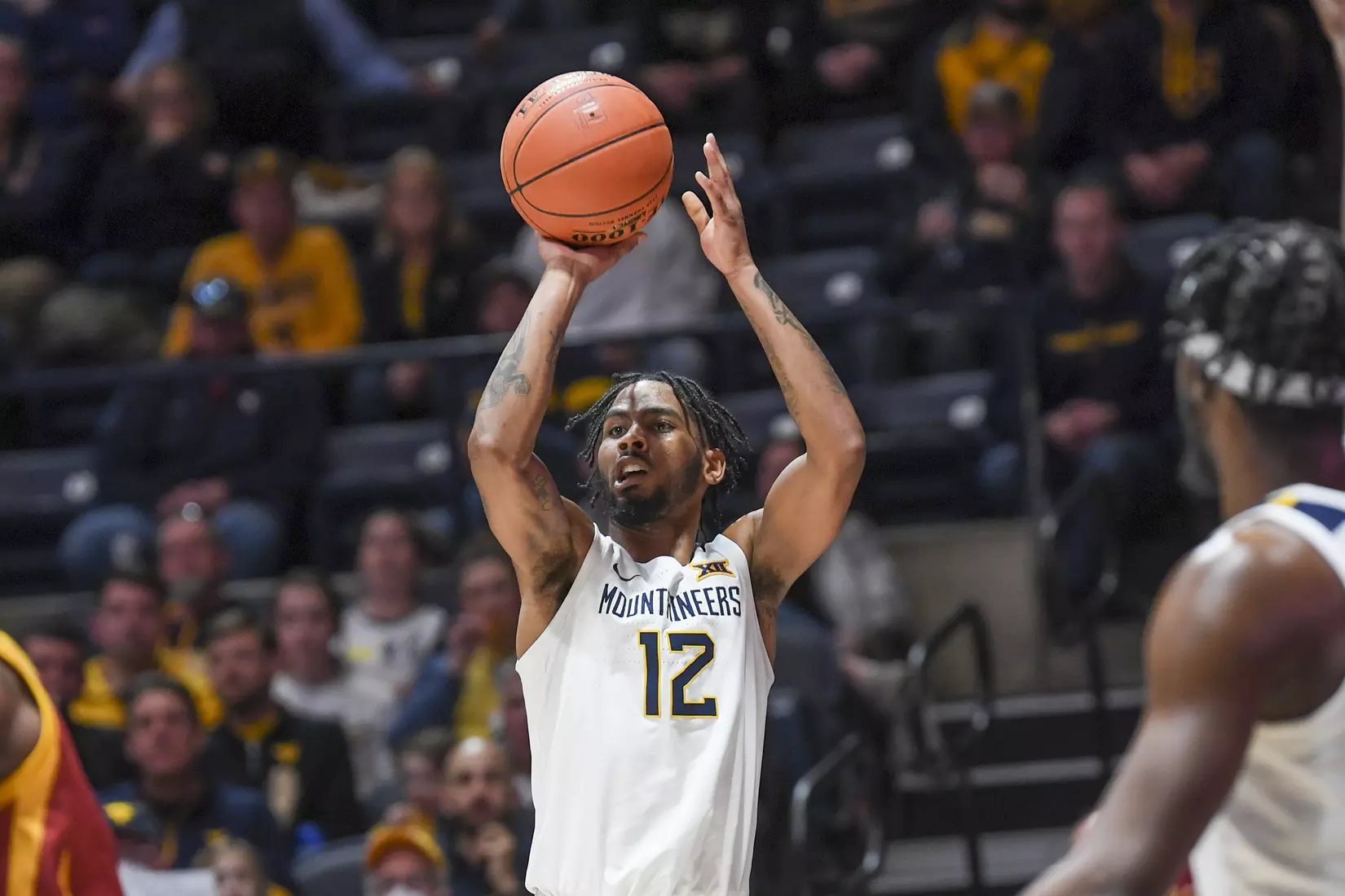 Derek Culver muscles his way to the basket.