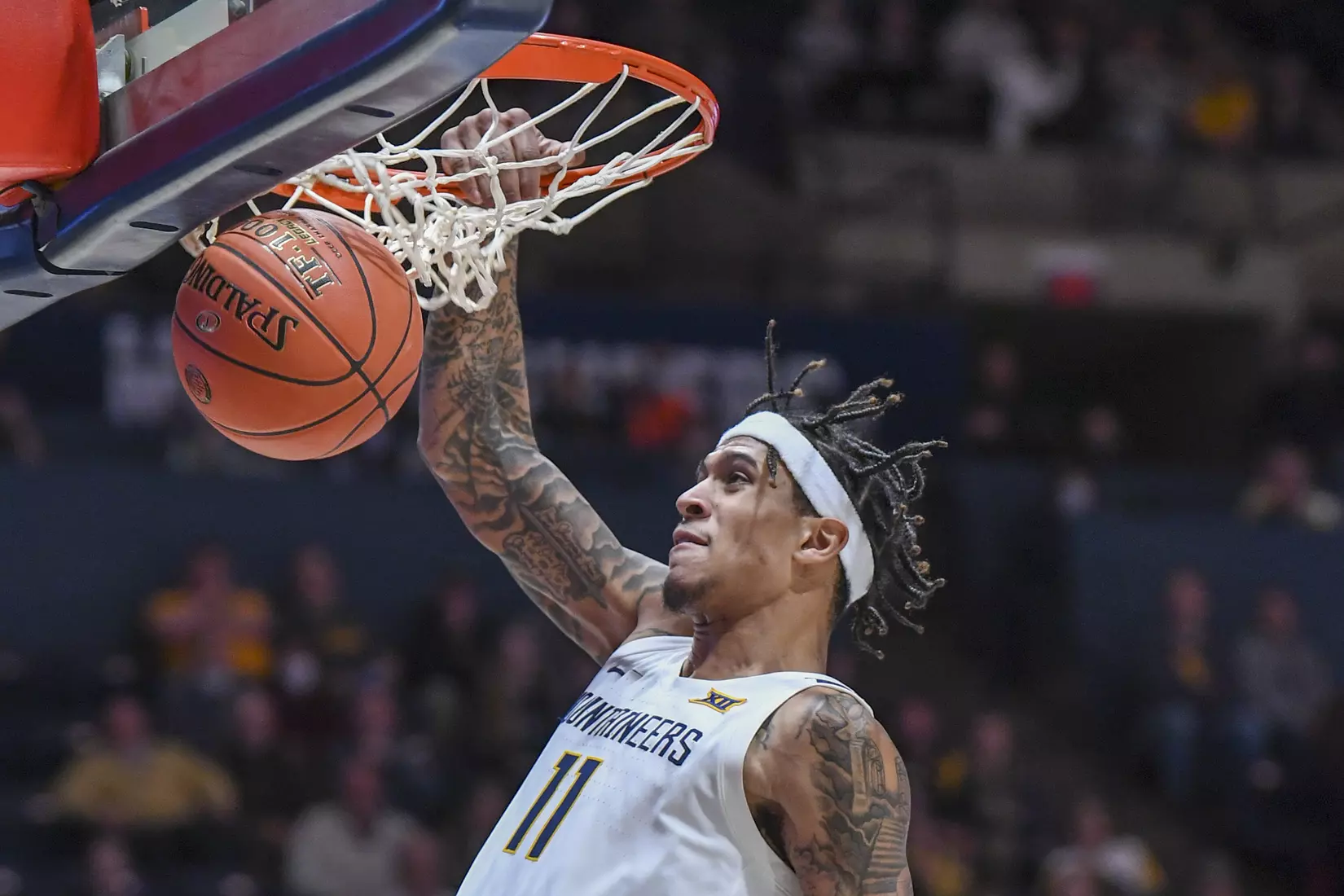 Oscar Tshiebwe scores on an awkward shot under the basket.