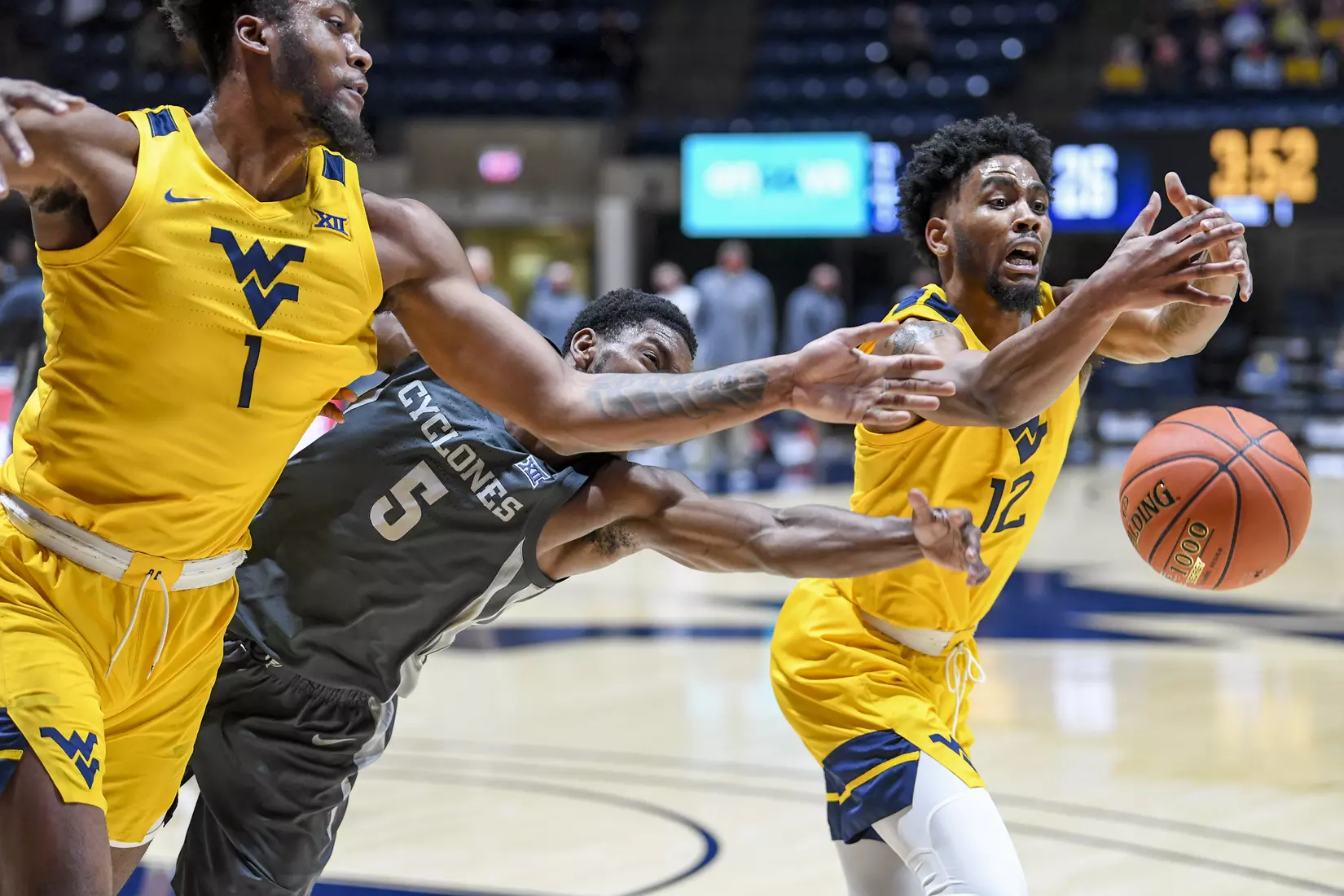 Derek Culver and Taz Sherman fight for a loose ball.