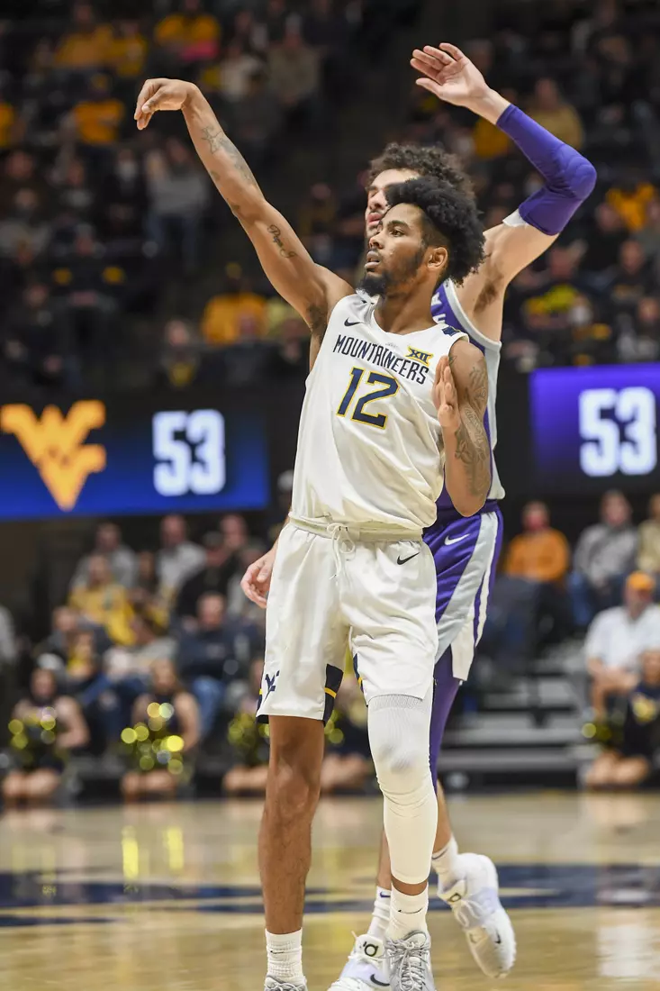 Taz Sherman holds the three pointer pose.