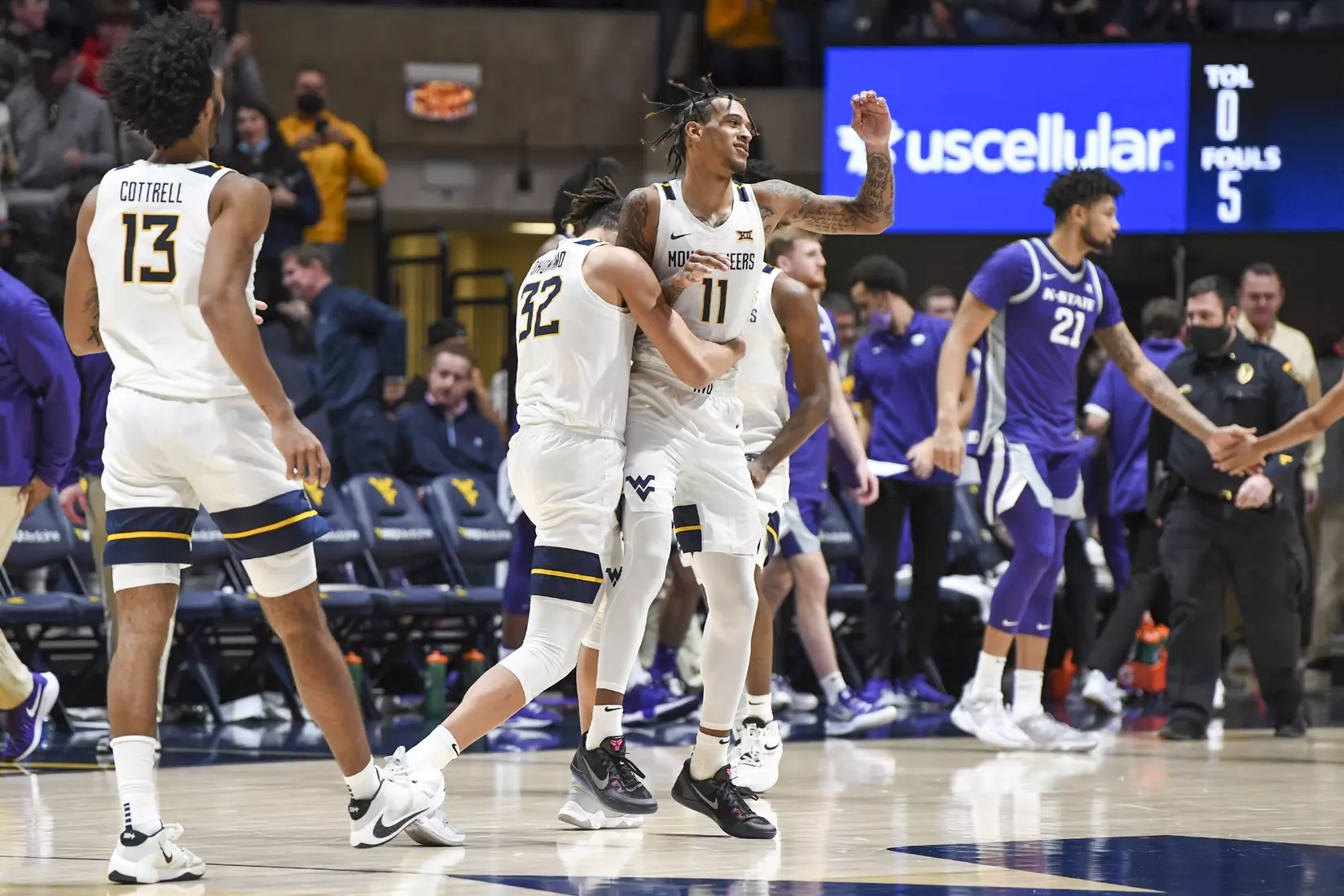 Jalen Bridges and the Mountaineers celebrate the win.