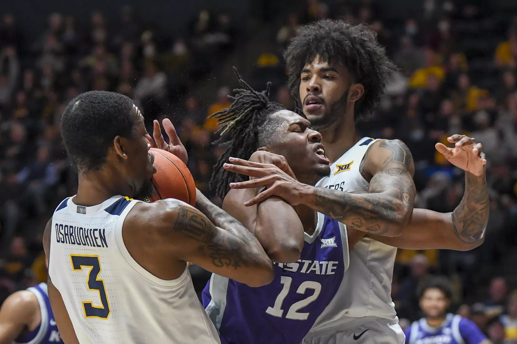 Gabe Osabuohien and Isaiah Cottrell team up on defense.