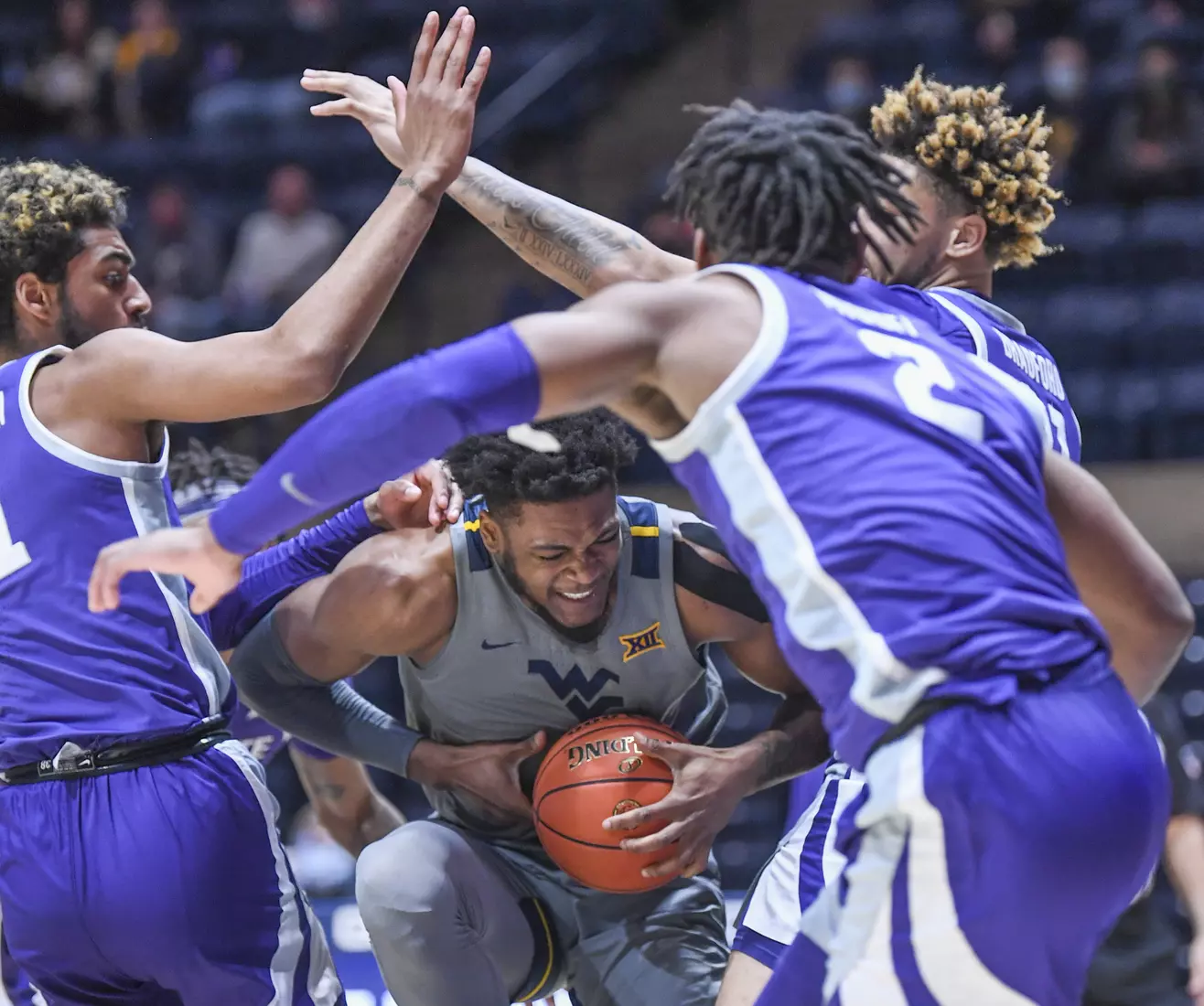 Derek Culver tries to work out of a triple-team.