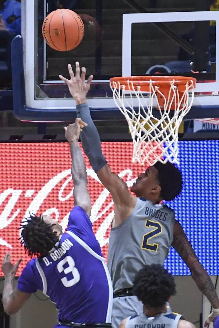 Jalen Bridges blocks a shot.