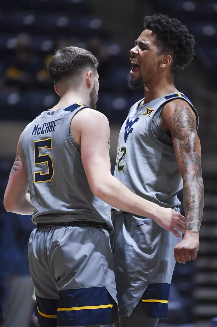 Taz Sherman celebrates Jordan McCabe's reverse layup basket.