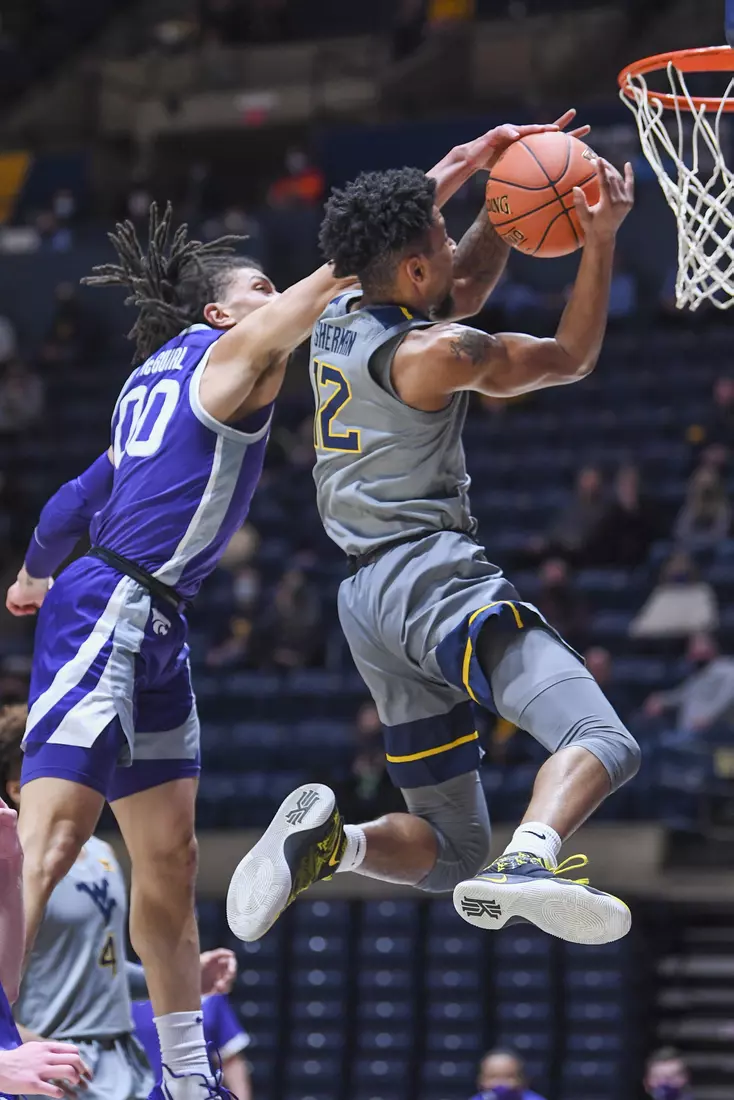 Taz Sherman is fouled on his way to the hoop.
