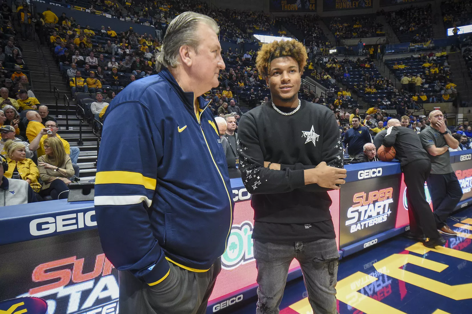 Bob Huggins talks with Duece McBride.