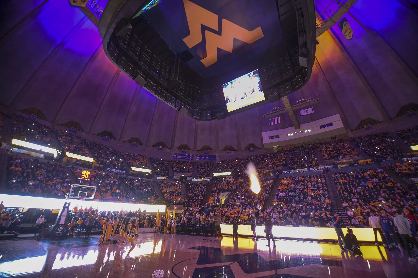 Mountaineer mascot Colson Glover fires hit musket.